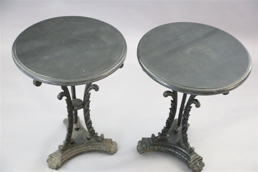 A pair of early Victorian cast iron occasional tables, Diam. 1ft 9in. H.2ft 4in.